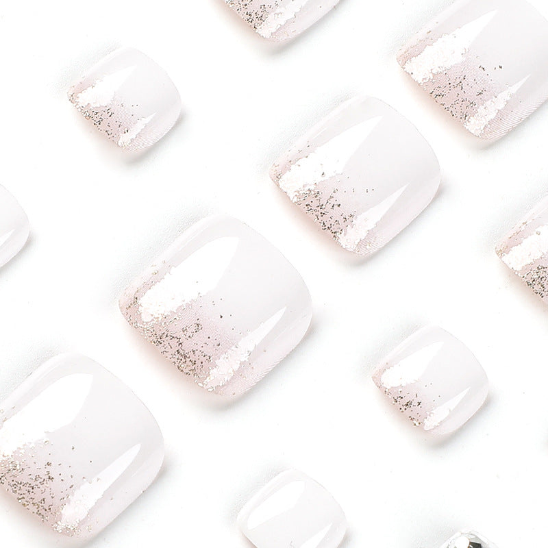 Artful toenail design with sparkling embellishments Stornfield