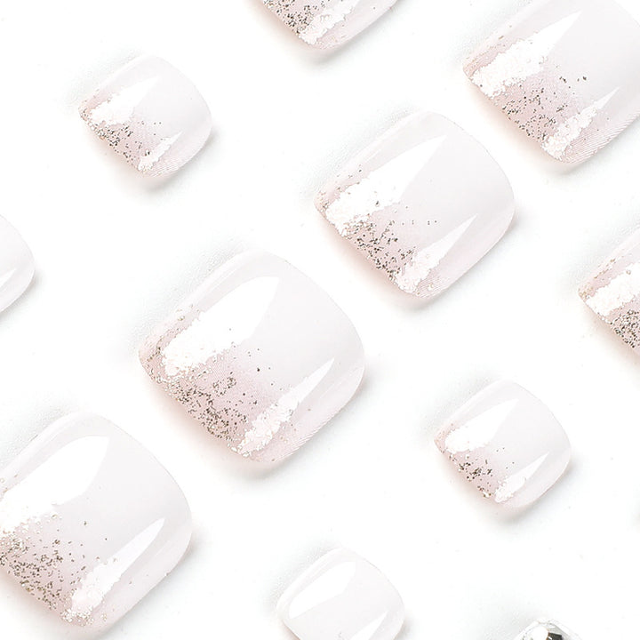 Artful toenail design with sparkling embellishments Stornfield