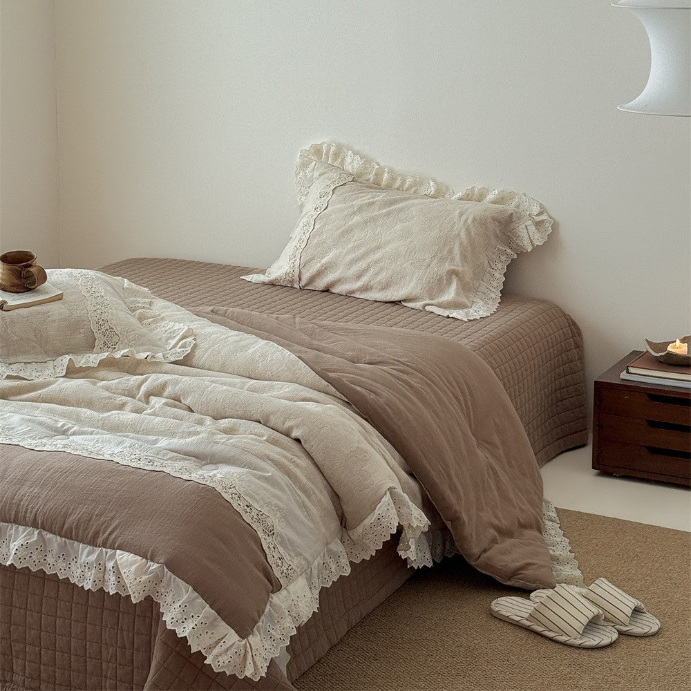 Vintage cotton bedding set with lace trim and hand-drawn floral pattern