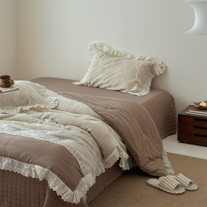 Vintage cotton bedding set with lace trim and hand-drawn floral pattern