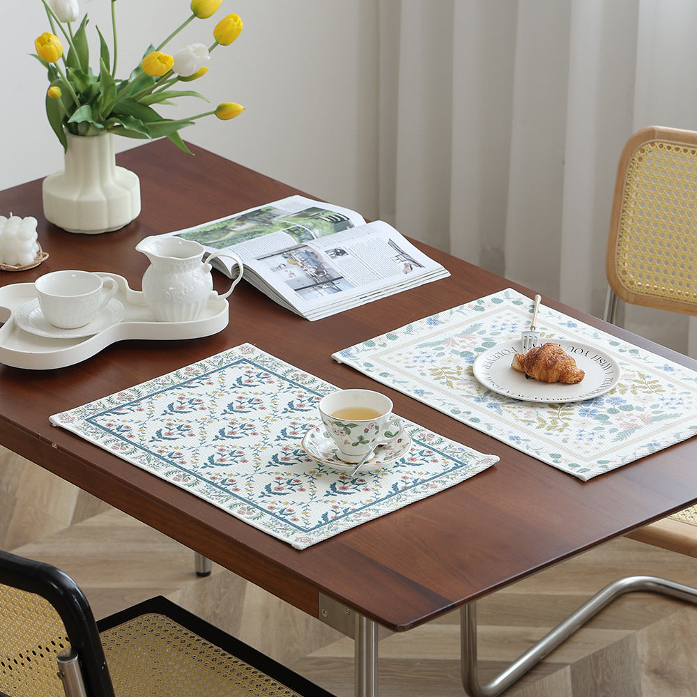 Floral woven bath mat with jacquard structure, absorbent cotton surface and non-slip underside Stornfield