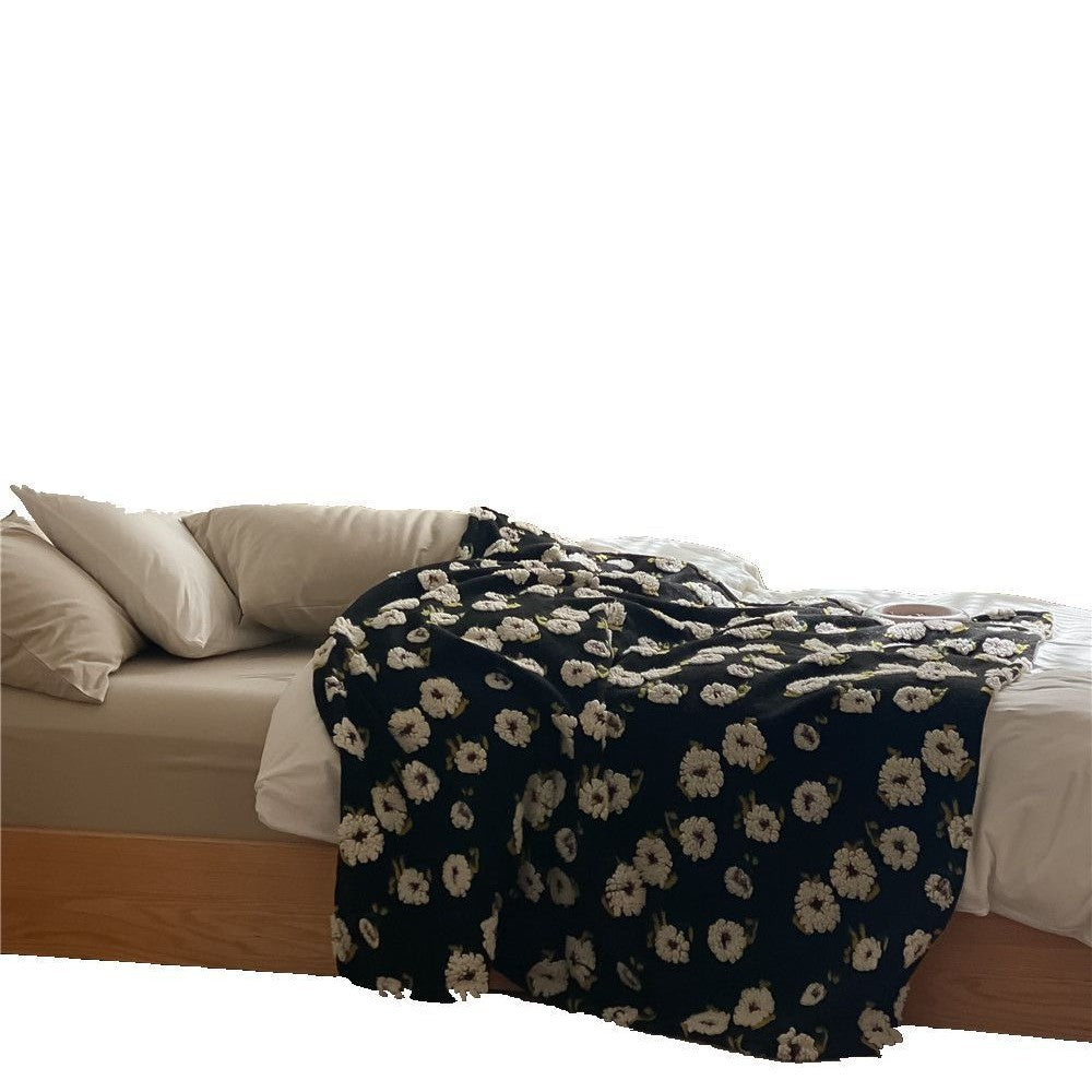 Cuddly blanket with floral bouclé surface and minky reversible fleece
