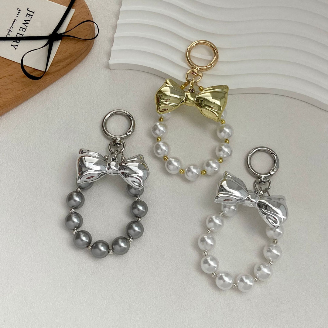 Elegant Pearl Bow Keychain Stornfield