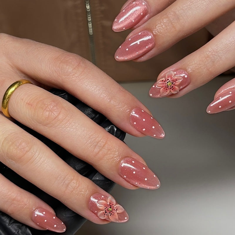Artificial nail set with glamorous glitter design and floral accent Stornfield