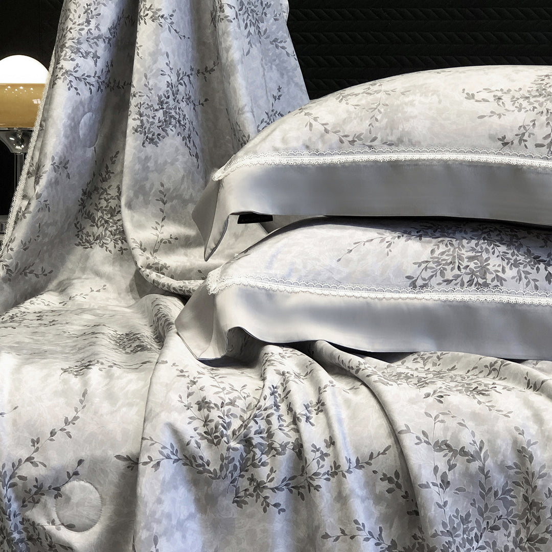 Pillowcase set made of cotton satin with delicate lace trim and satin piping