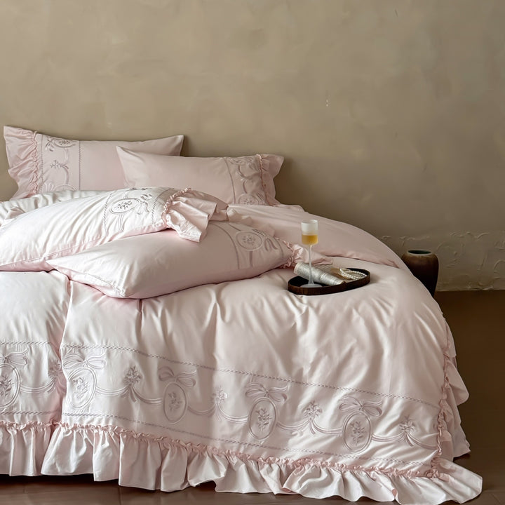 Luxurious embroidered bedding set with ruffle and pillowcases
