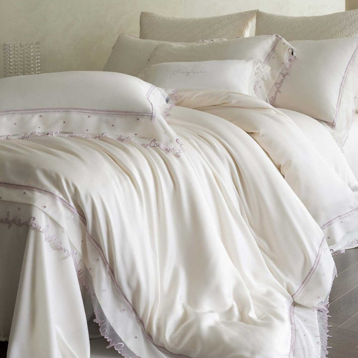 Satin bed linen set with delicate organza ruffle and lace trim