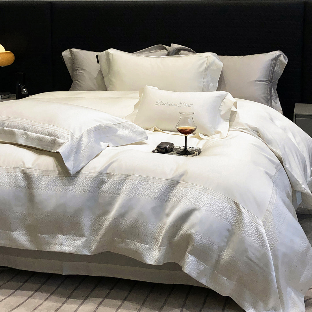 Premium cotton satin bedding set with structured matelassé border and hotel closure