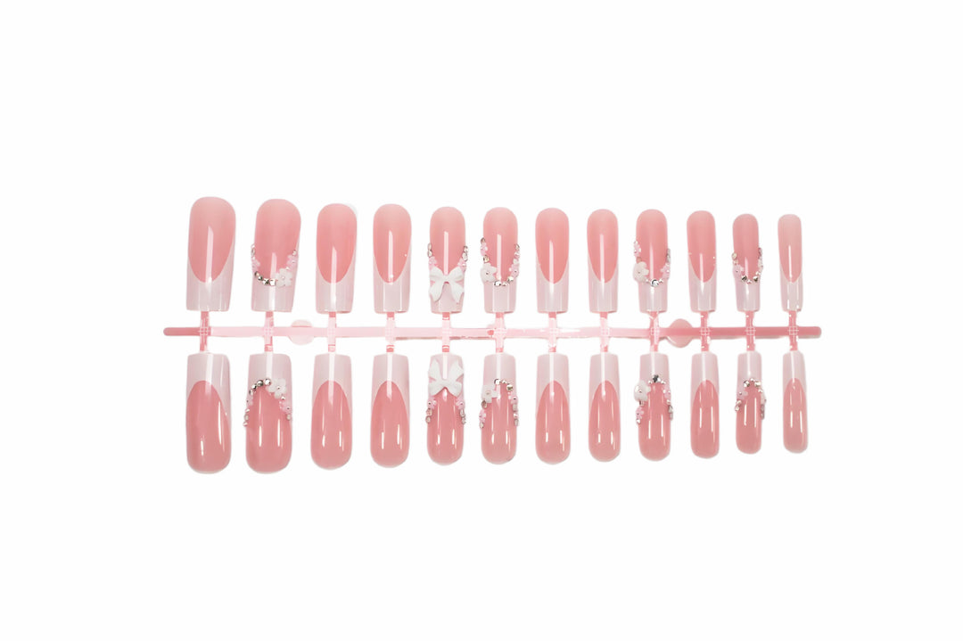 Acrylic Nail Set with Elegant Bows and Glitter Accents Stornfield