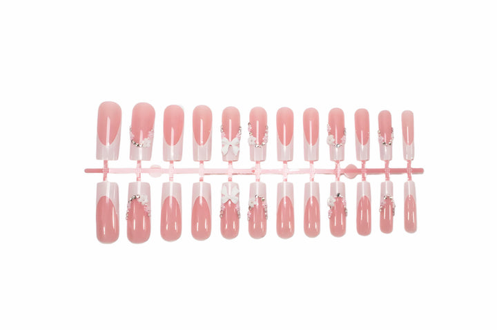Acrylic Nail Set with Elegant Bows and Glitter Accents Stornfield