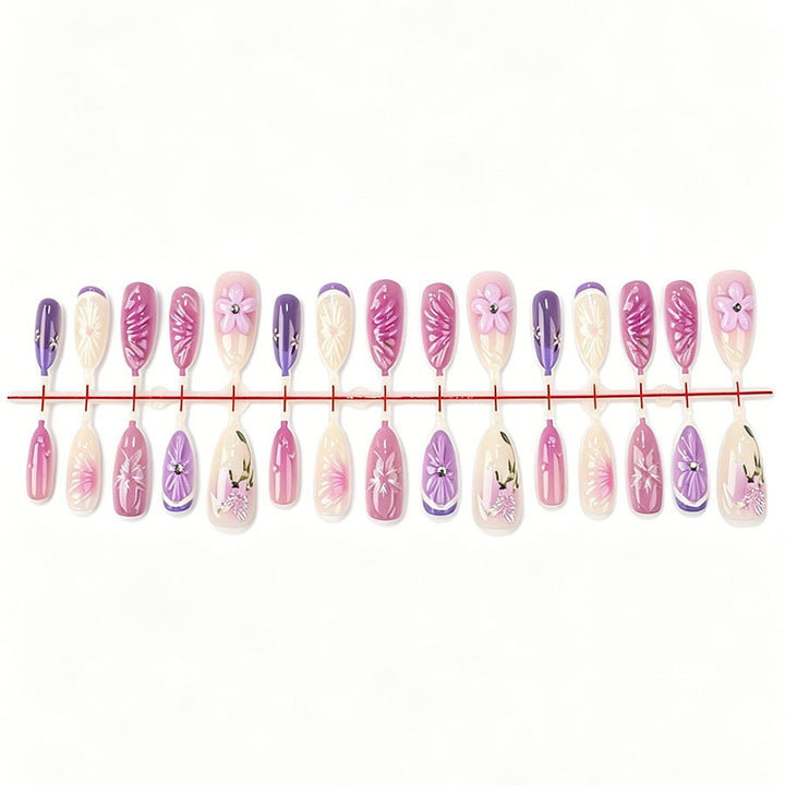 Decorative artificial nails with floral designs and glitter accents Stornfield