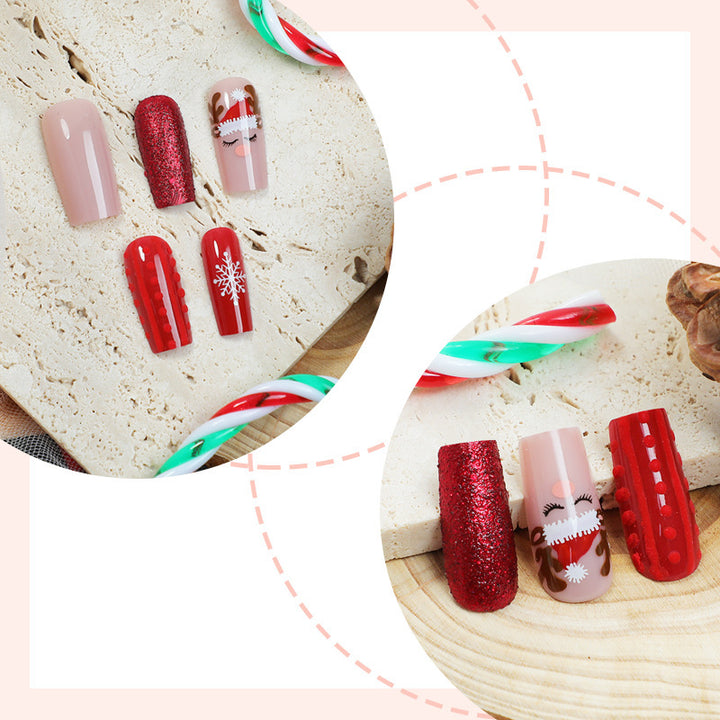 Artificial nail set with festive Christmas designs and glitter accents Stornfield