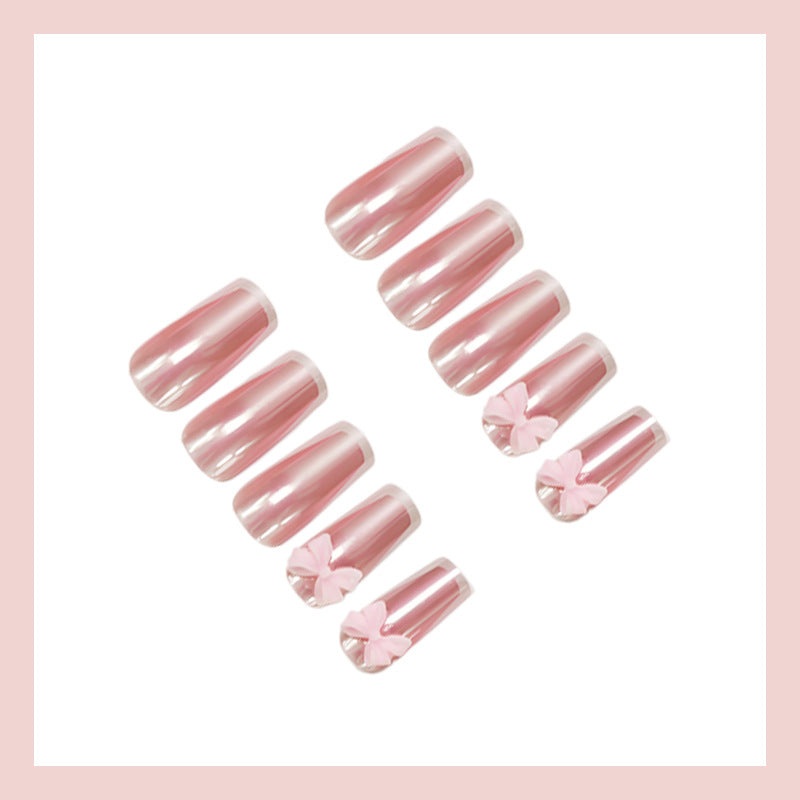 Artificial nail set with stylish bows and elegant French tips Stornfield