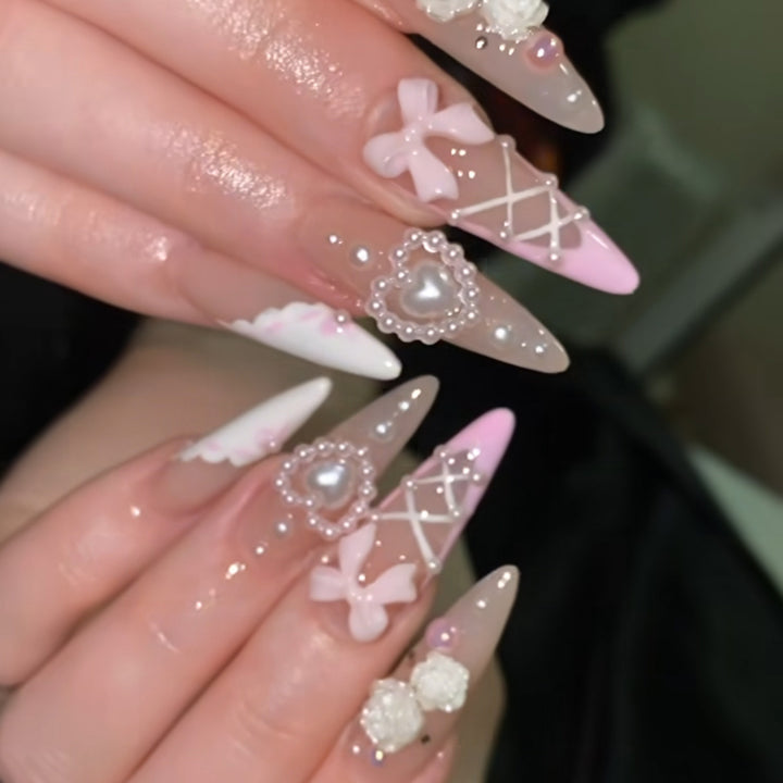 Artful stiletto nails with romantic accents Stornfield
