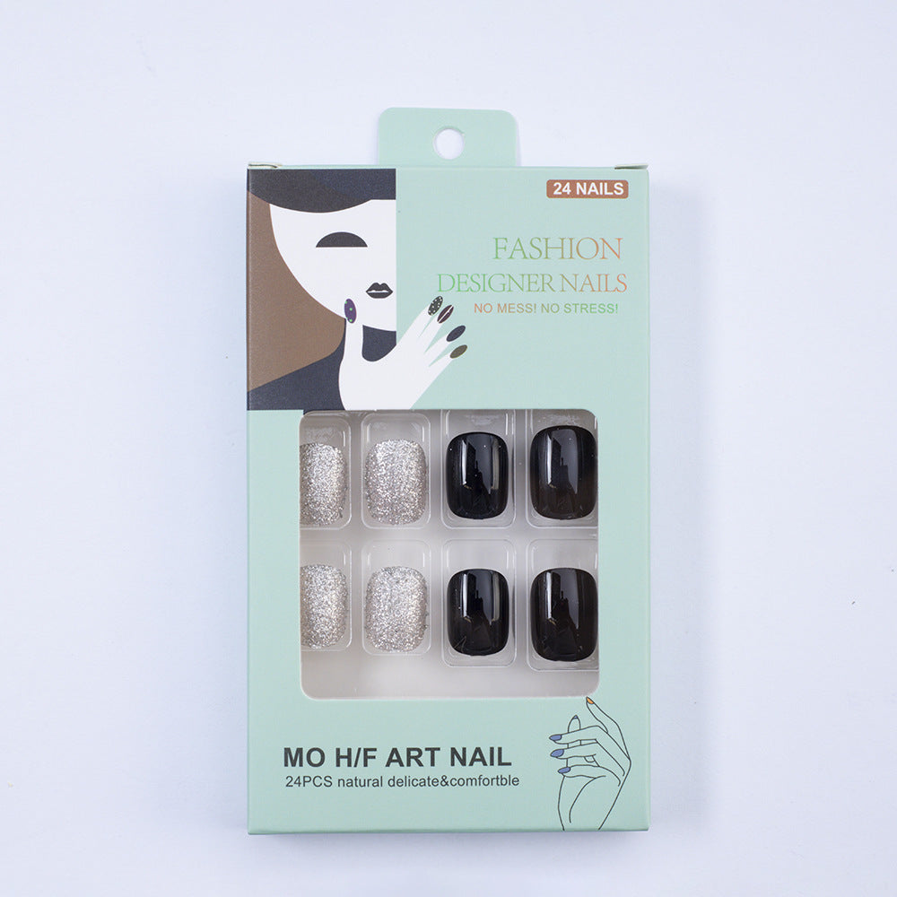 Artificial nails in elegant black with gloss and creative accents Stornfield