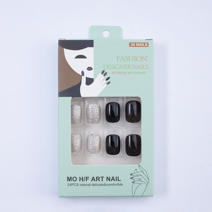 Artificial nails in elegant black with gloss and creative accents Stornfield