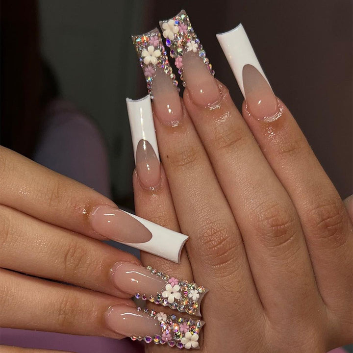 Artful Nail Extensions with Glitter and Flower Decor Stornfield