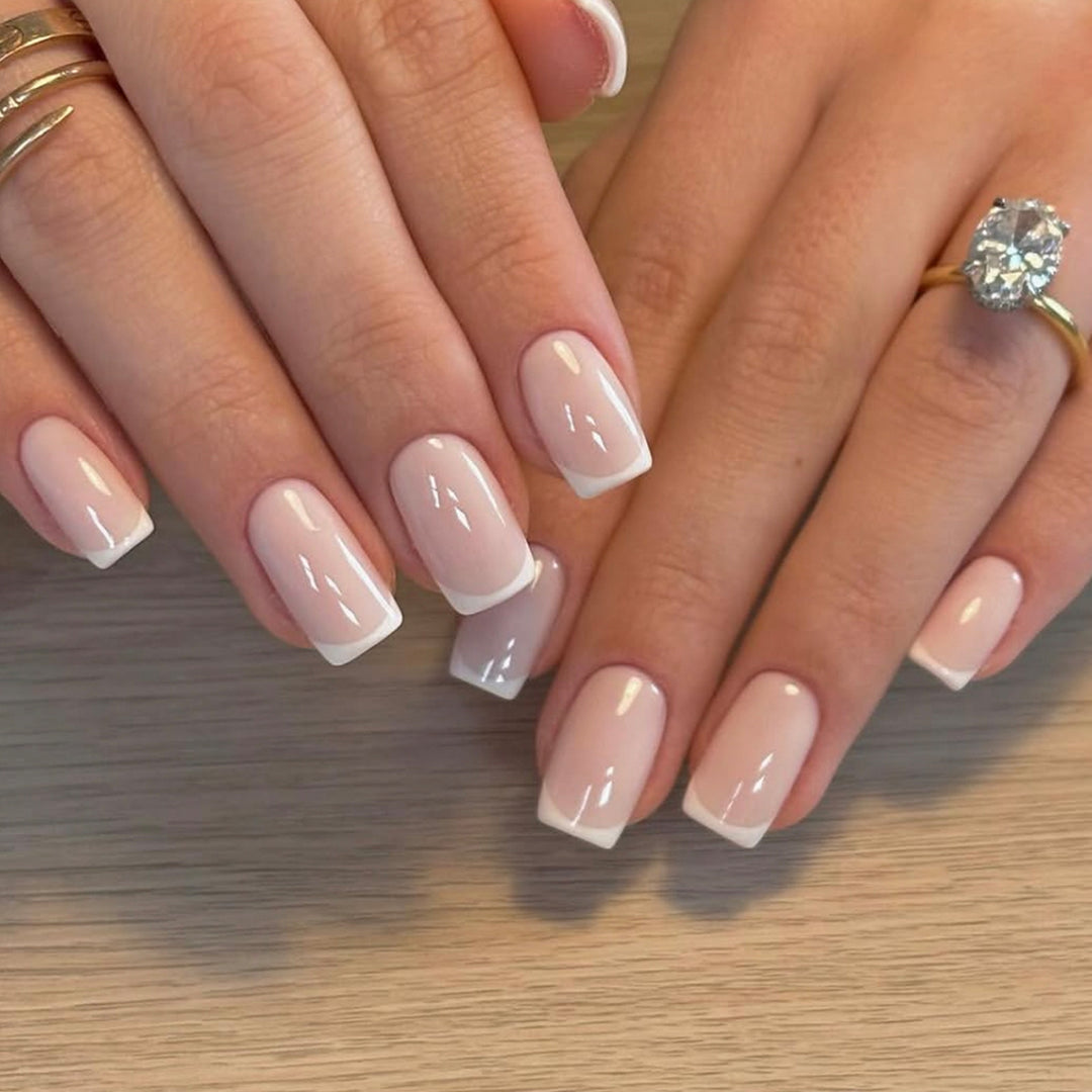 Classic nail extensions with elegant French tips Stornfield