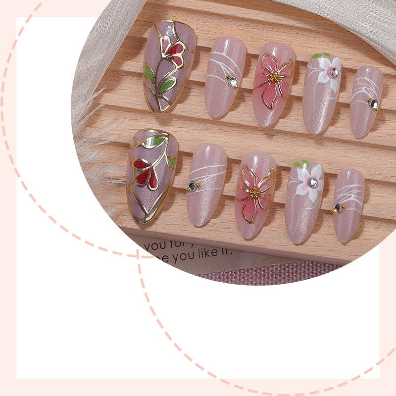 Nail art set with filigree floral decorations and shiny details Stornfield