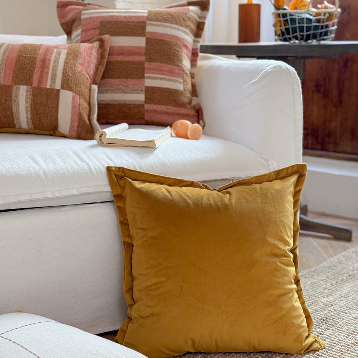 Decorative cushion made of linen look with hand-tied fringes and cross-stitch detail