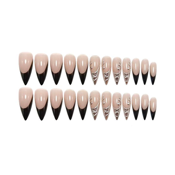 Artificial nails in elegant stiletto style with elaborate metal decoration Stornfield