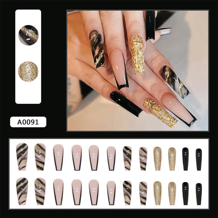 Acrylic nail set with luxurious golden accents and elegant designs Stornfield
