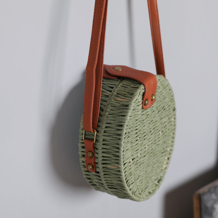 Round basket bag with leather accents Stornfield