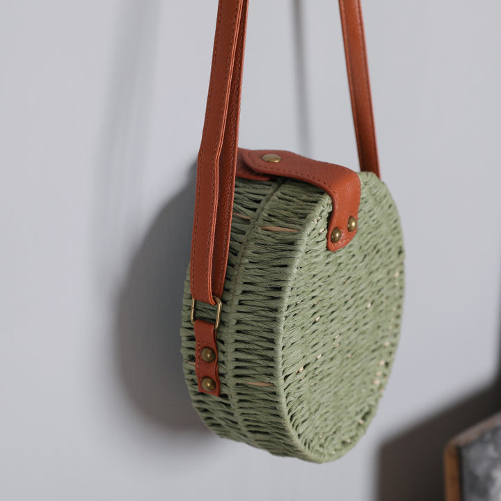Round basket bag with leather accents Stornfield