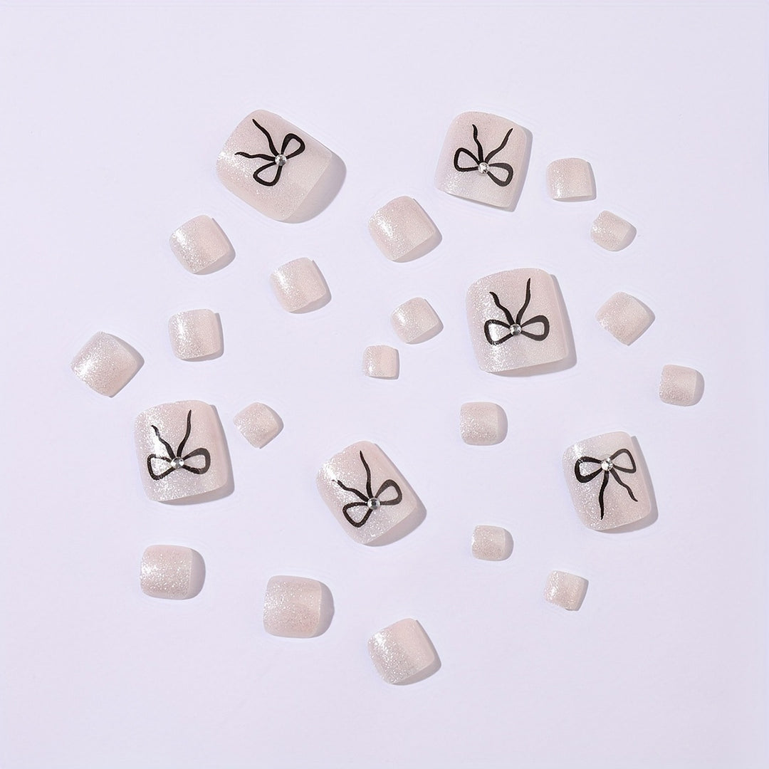 Acrylic nail set with sparkling accents and elegant bows Stornfield