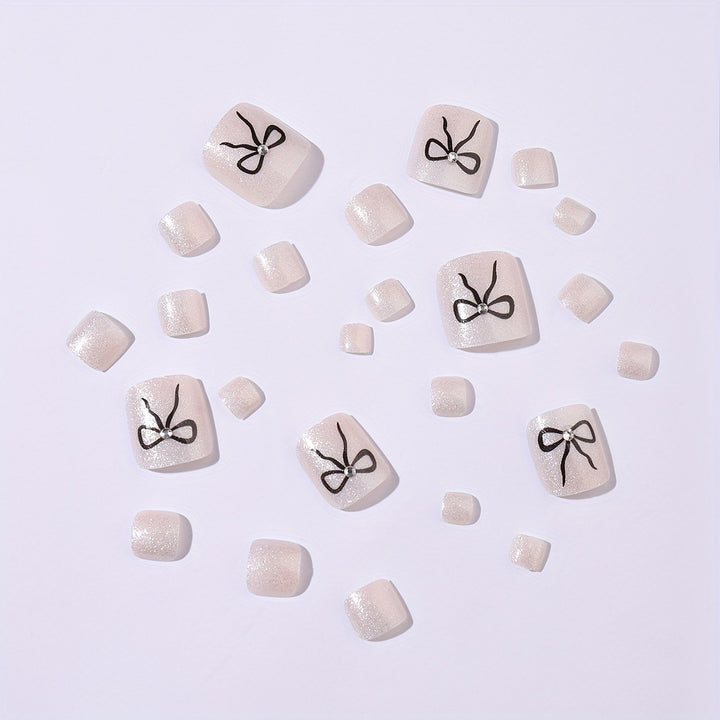 Acrylic nail set with sparkling accents and elegant bows Stornfield