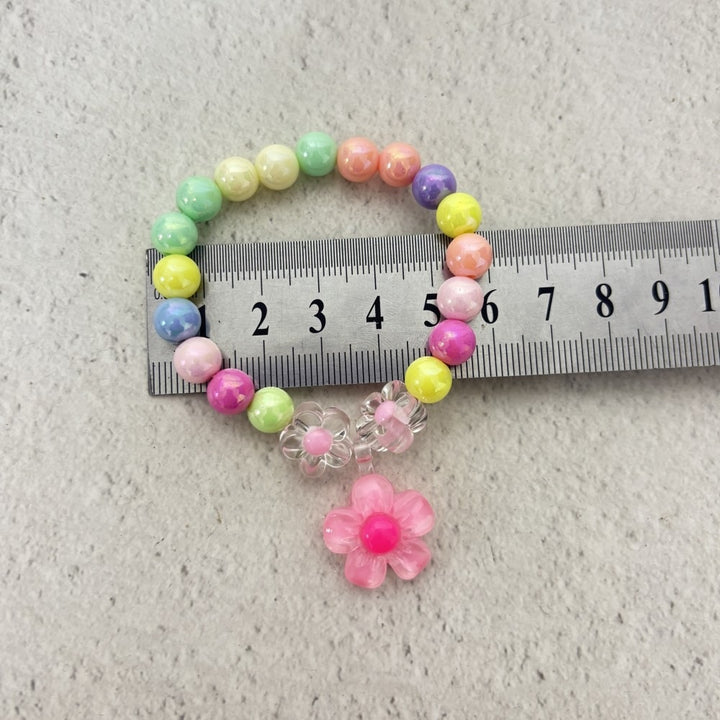 Colorful bracelet with flower charms Stornfield