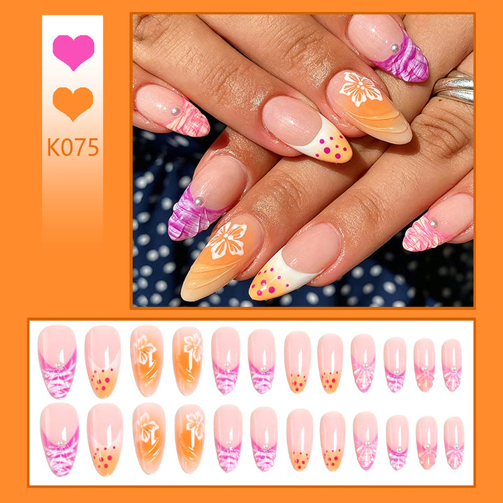 Acrylic nail set with exotic flower patterns and glitter accents Stornfield