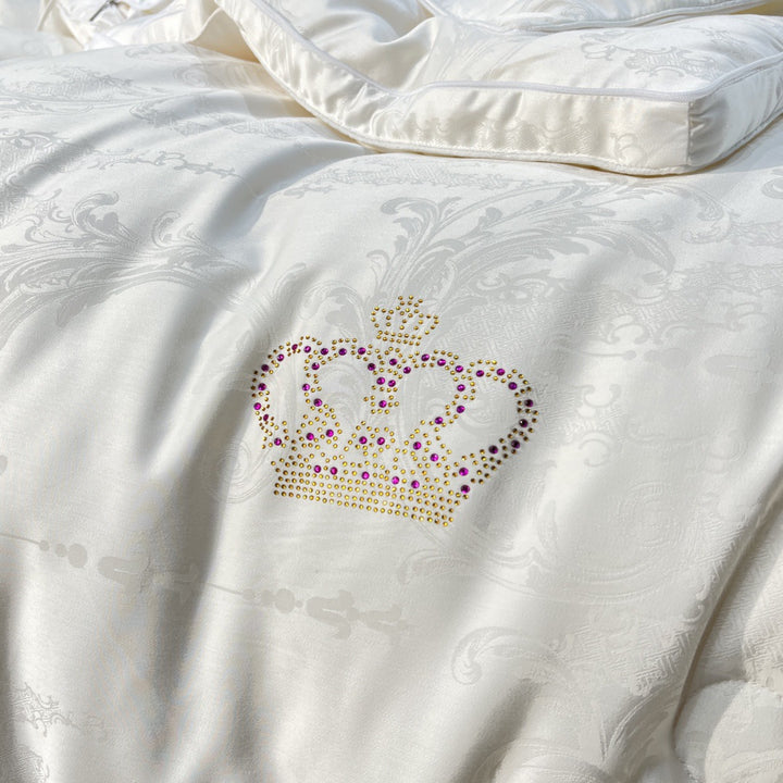 Quilted down look comforter with fine jacquard satin cover and crown embroidery