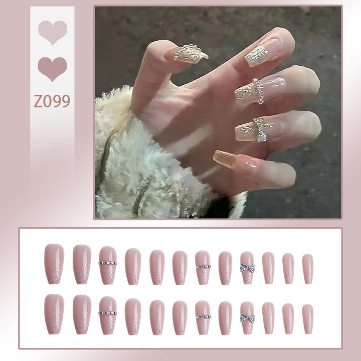 Glamorous artificial nails with sparkling rhinestone and glitter elements Stornfield