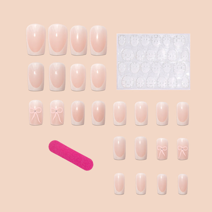 Nail art set with elegant bow and glitter accents Stornfield