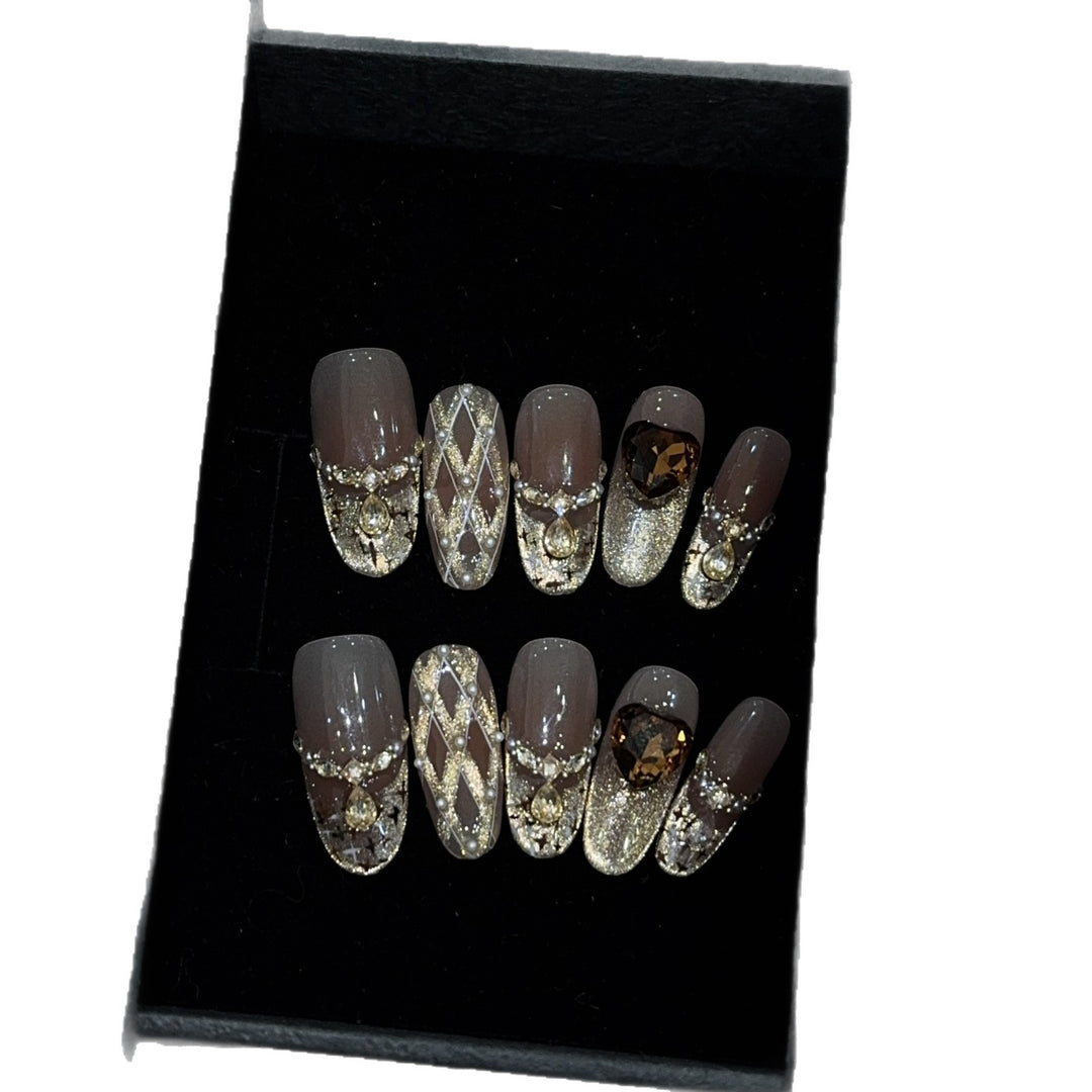 Glamorous artificial nails with glitter and heart design Stornfield