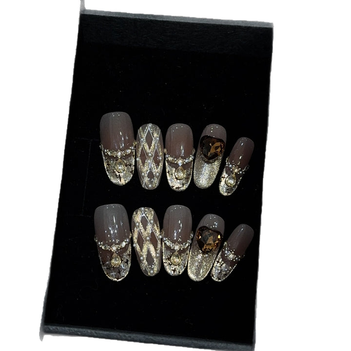Glamorous artificial nails with glitter and heart design Stornfield