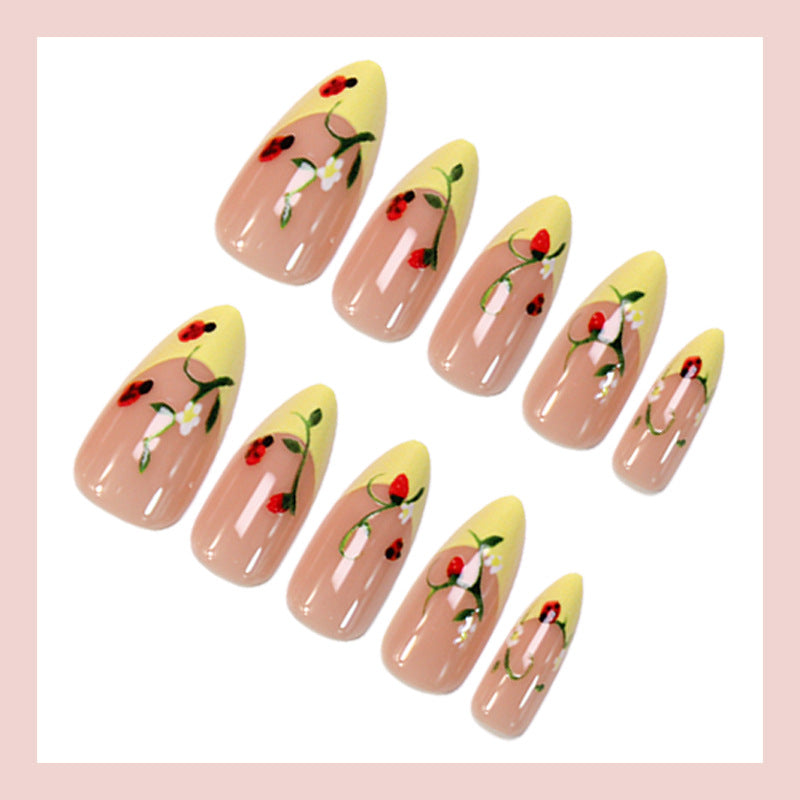 Artificial nail set with elegant gradient and floral accents Stornfield