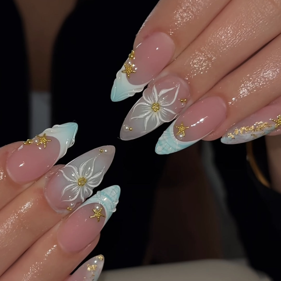 Artful stiletto nails with floral and glamorous accents Stornfield