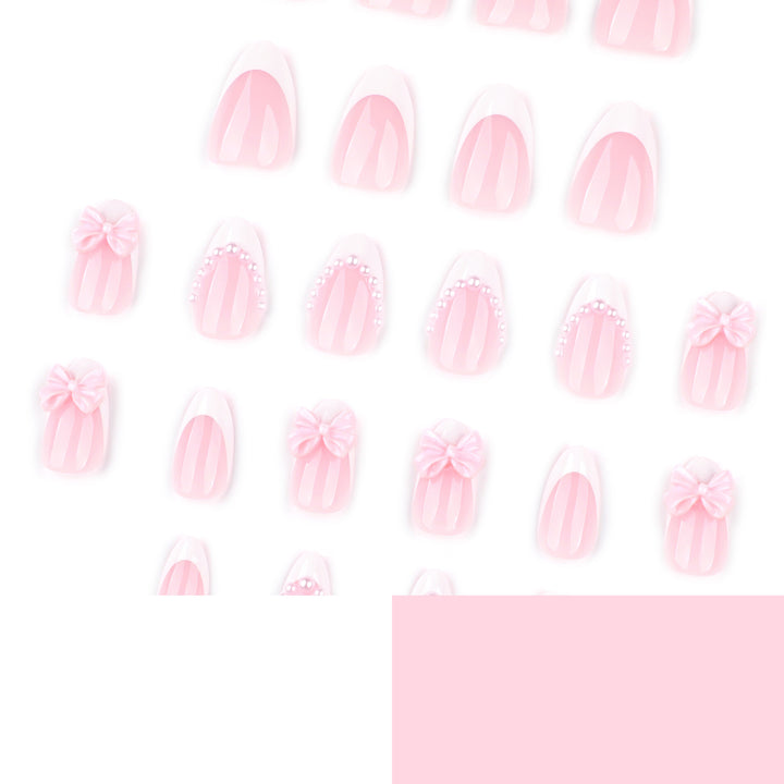 Artful Stiletto Nails with Delicate Bow Accents Stornfield