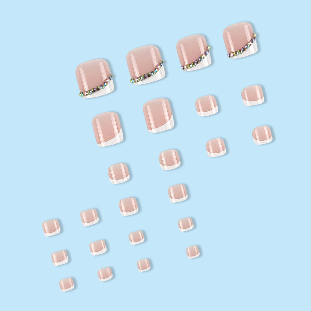 Nail art set with elegant French tips and glitter accents Stornfield