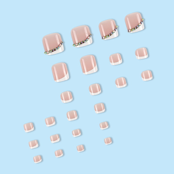 Nail art set with elegant French tips and glitter accents Stornfield