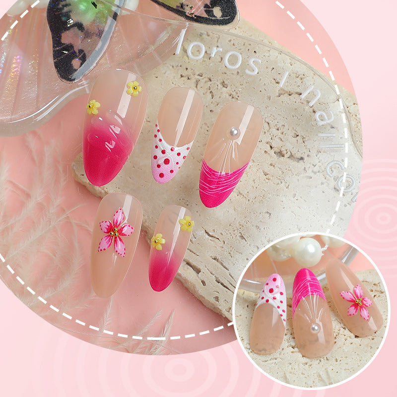 Artful nail tips with delicate floral embellishments Stornfield
