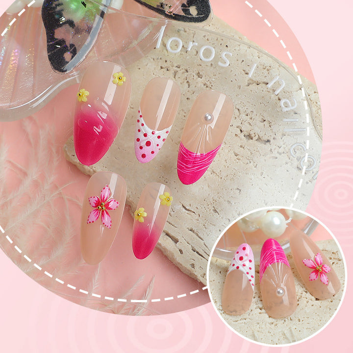 Artful nail tips with delicate floral embellishments Stornfield