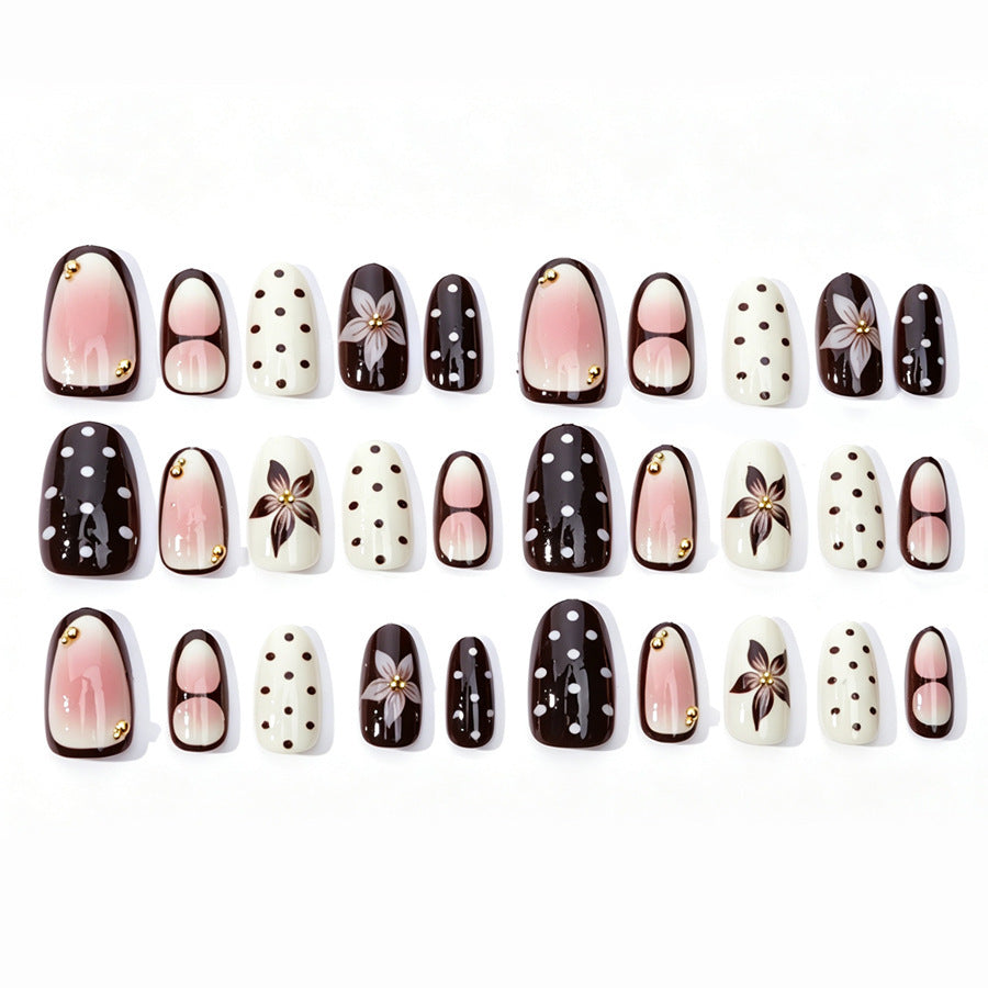Acrylic nail set with floral accents and elegant design Stornfield
