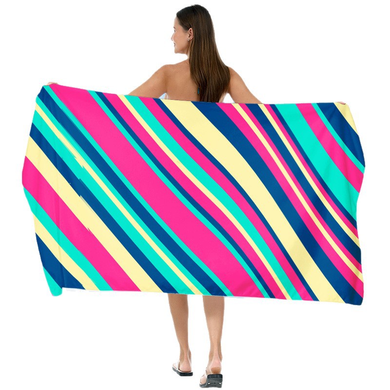 Beach towel with vibrant gradient color and stylish striped design Stornfield