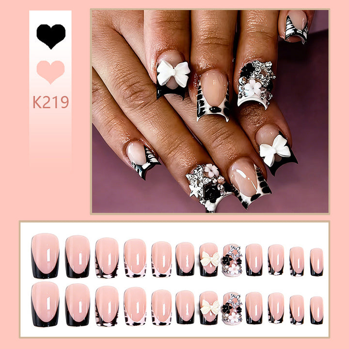 Artificial nail design with elaborate 3D decorations Stornfield