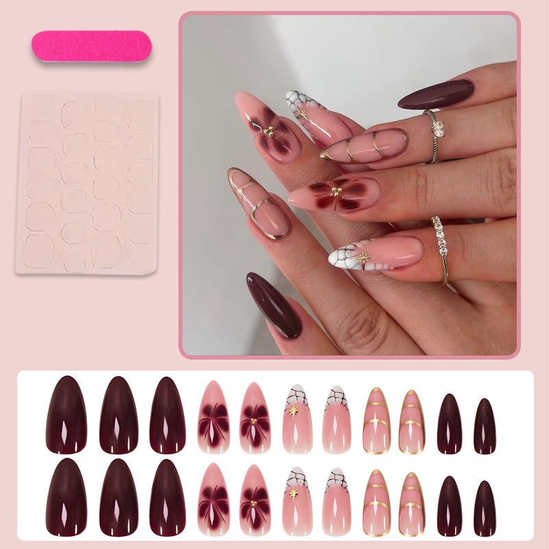 Artificial nail set with elegant floral and glamorous design elements Stornfield