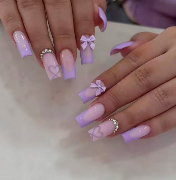 Artificial nail set with elegant 3D bows and glitter details Stornfield