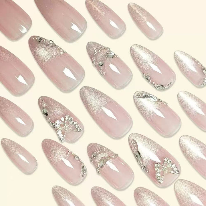 Elegant Stiletto Nail Design with Rhinestone Embellishments Stornfield